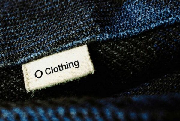 A close-up shot of a woven fabric label stitched onto a piece of clothing.