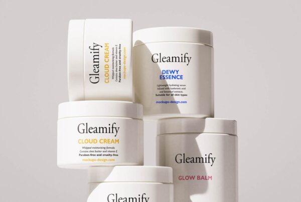 A stacked arrangement of five minimalist white cosmetic jars with clean typography labels under soft studio lighting.