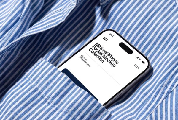 An iPhone showing a clean user interface design while tucked safely inside the breast pocket of a blue and white striped shirt.