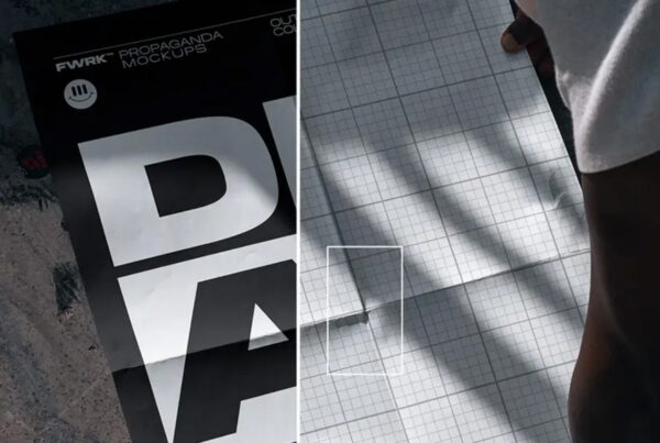 A close-up shot of a folded A2 poster resting on a rough concrete floor in natural daylight.